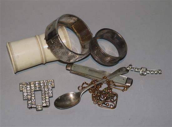A silver bracelet, silver napkin ring, fruit knife and other items.